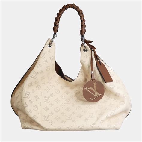 cream color louis vuitton bag|louis vuitton mahina carmel bag.